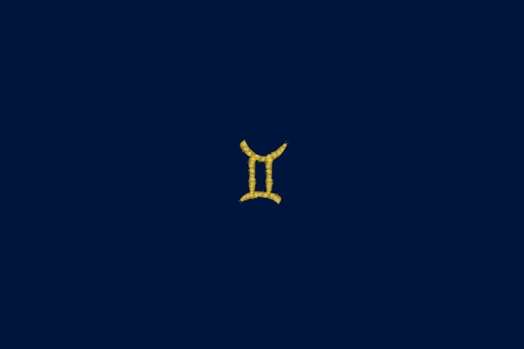 Ilustração do signo de gêmeos em dourado e no formato de uma corda em um fundo azul-escuro