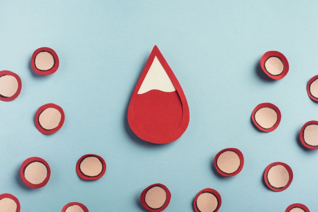Ilustração de um gota de sangue em cima de um fundo azul claro