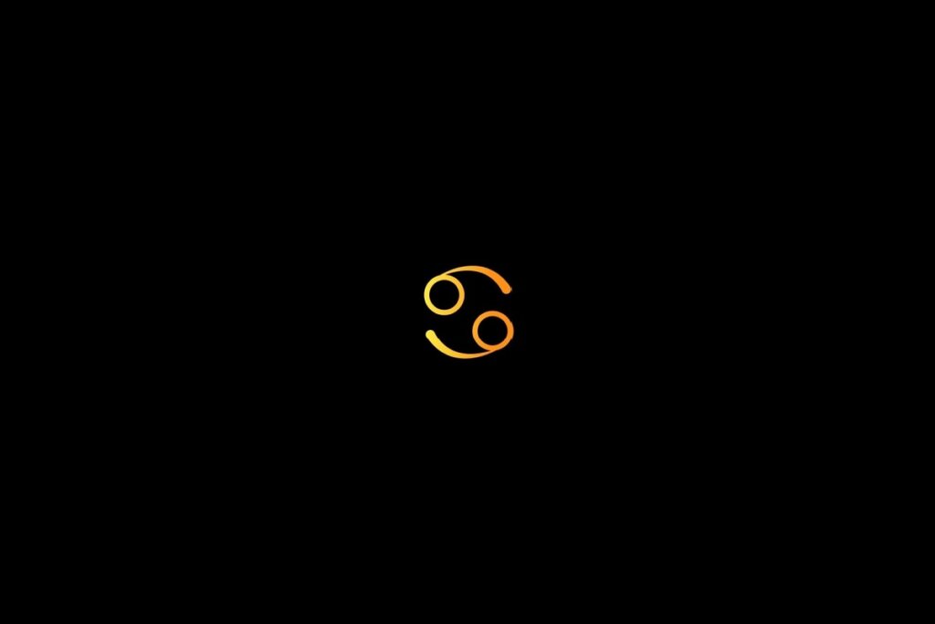 Ilustração do signo de câncer em amarelo, centralizado em um fundo preto