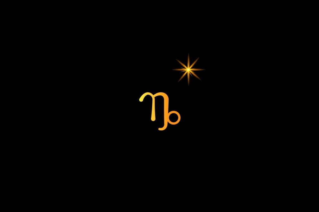 Ilustração do signo de capricórnio em amarelo, em um fundo preto, com uma estrela do lado direito superior