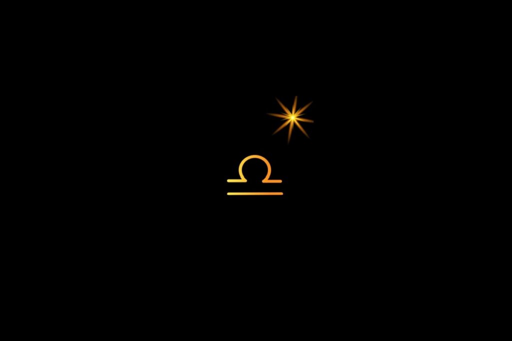 Ilustração do signo de libra em amarelo, em um fundo preto, com uma estrela do lado direito superior