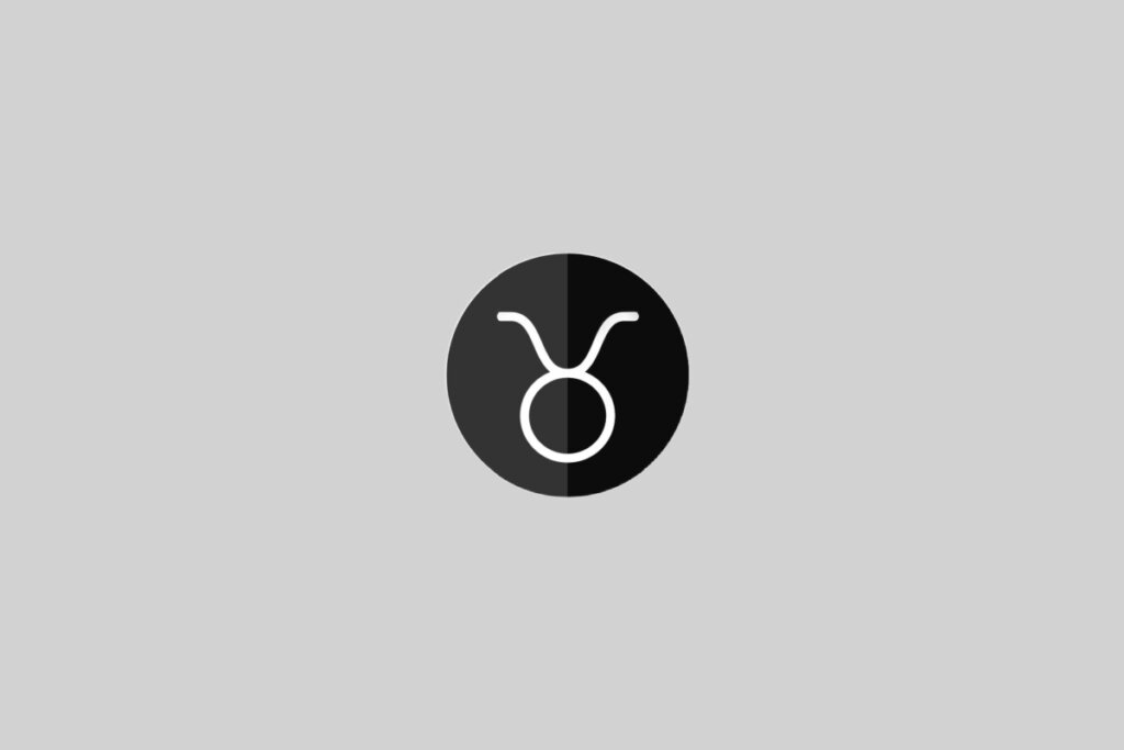 Ilustração do signo de Touro, contendo um círculo com dois traços curvos no topo representando os chifres, em círculo bicolor (preto e branco) em fundo cinza