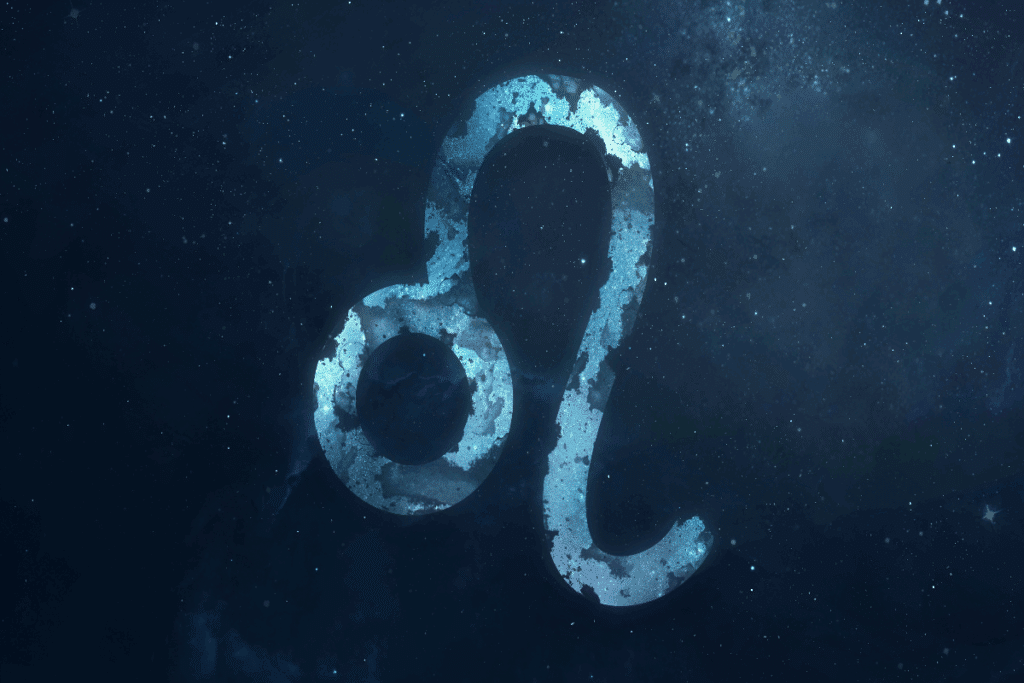 A imagem mostra o símbolo do signo de leão em destaque sobre um fundo que representa o espaço, repleto de estrelas e nebulosas. O ícone aparece em tons de azul, com textura que se mistura ao cenário cósmico.