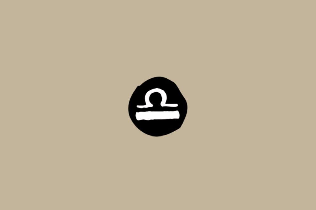 Símbolo do signo de Libra em branco dentro de círculo preto em fundo bege