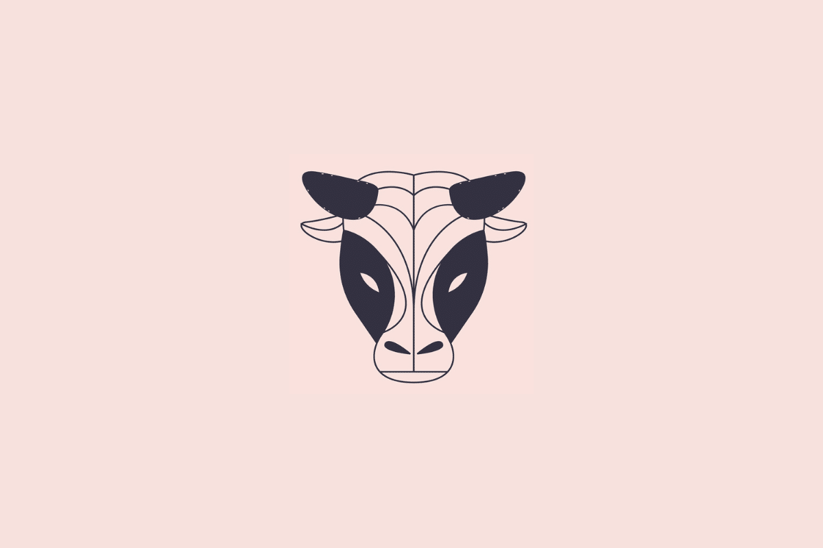 Ilustração estilizada e minimalista da cabeça de um touro, simbolizando o signo de touro, em tom azul-escuro sobre um fundo rosa-claro