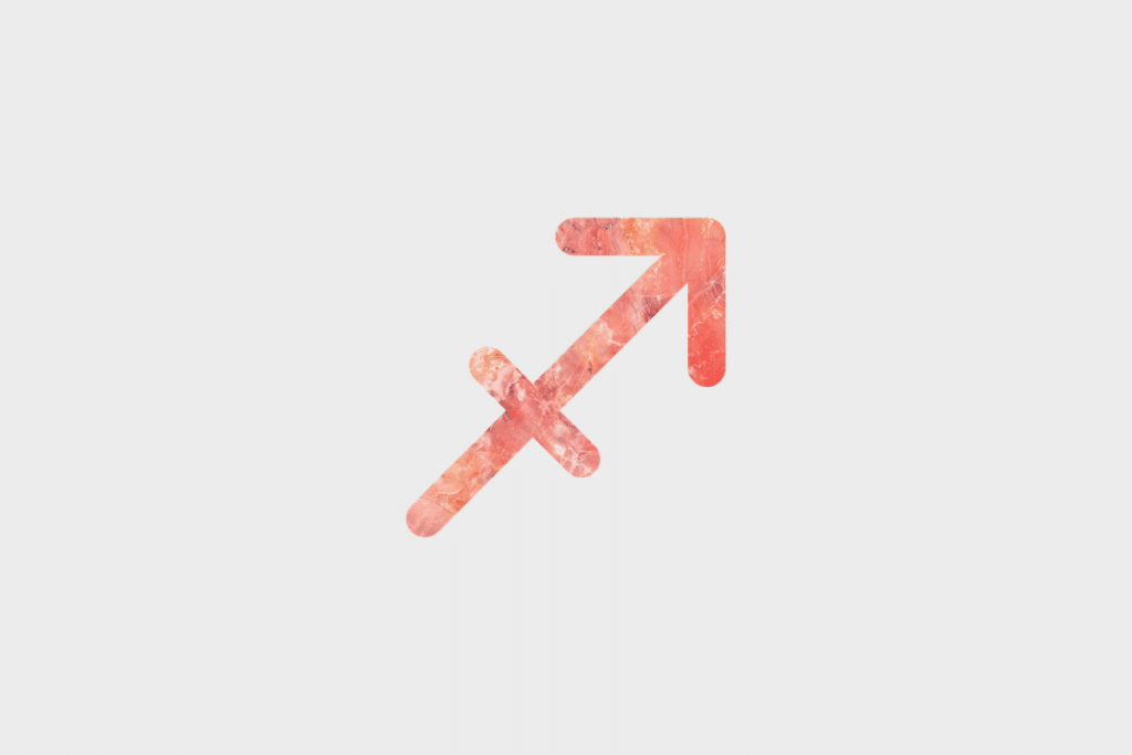 Ilustração do signo Sagitário, contendo o símbolo do signo com textura de mármore em tons de coral e rosa, formado por uma flecha apontando para cima na diagonal, cruzada por um traço, em fundo cinza-claro.