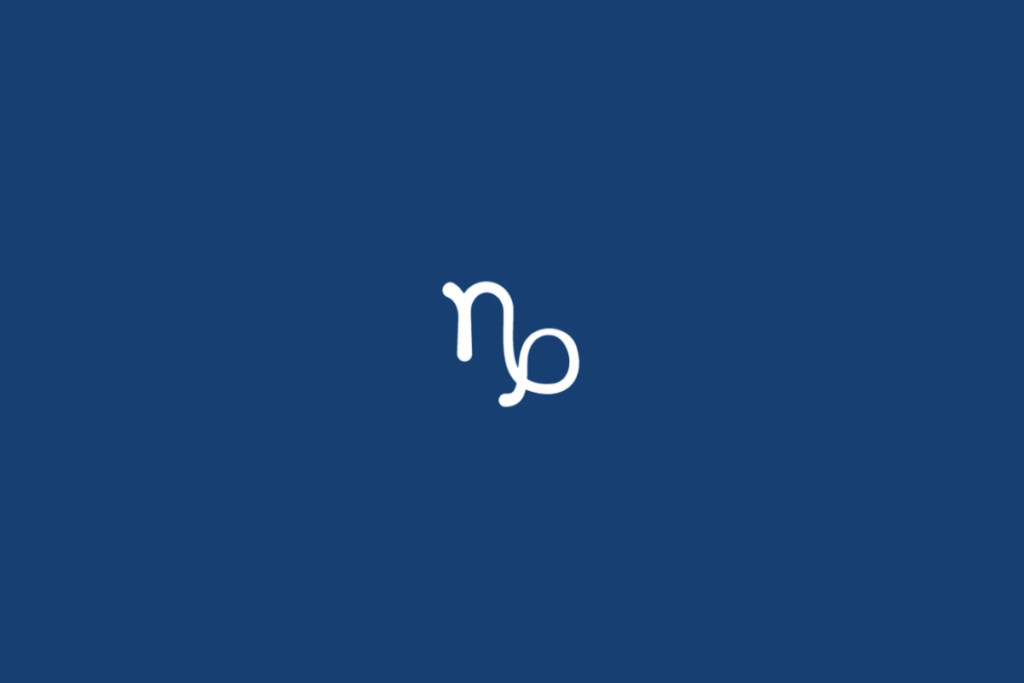 Símbolo do signo de Capricórnio, em branco, formado por uma linha vertical que se curva na parte superior e se conecta a um traço que termina em um laço arredondado à direita. O fundo é azul-marinho uniforme.